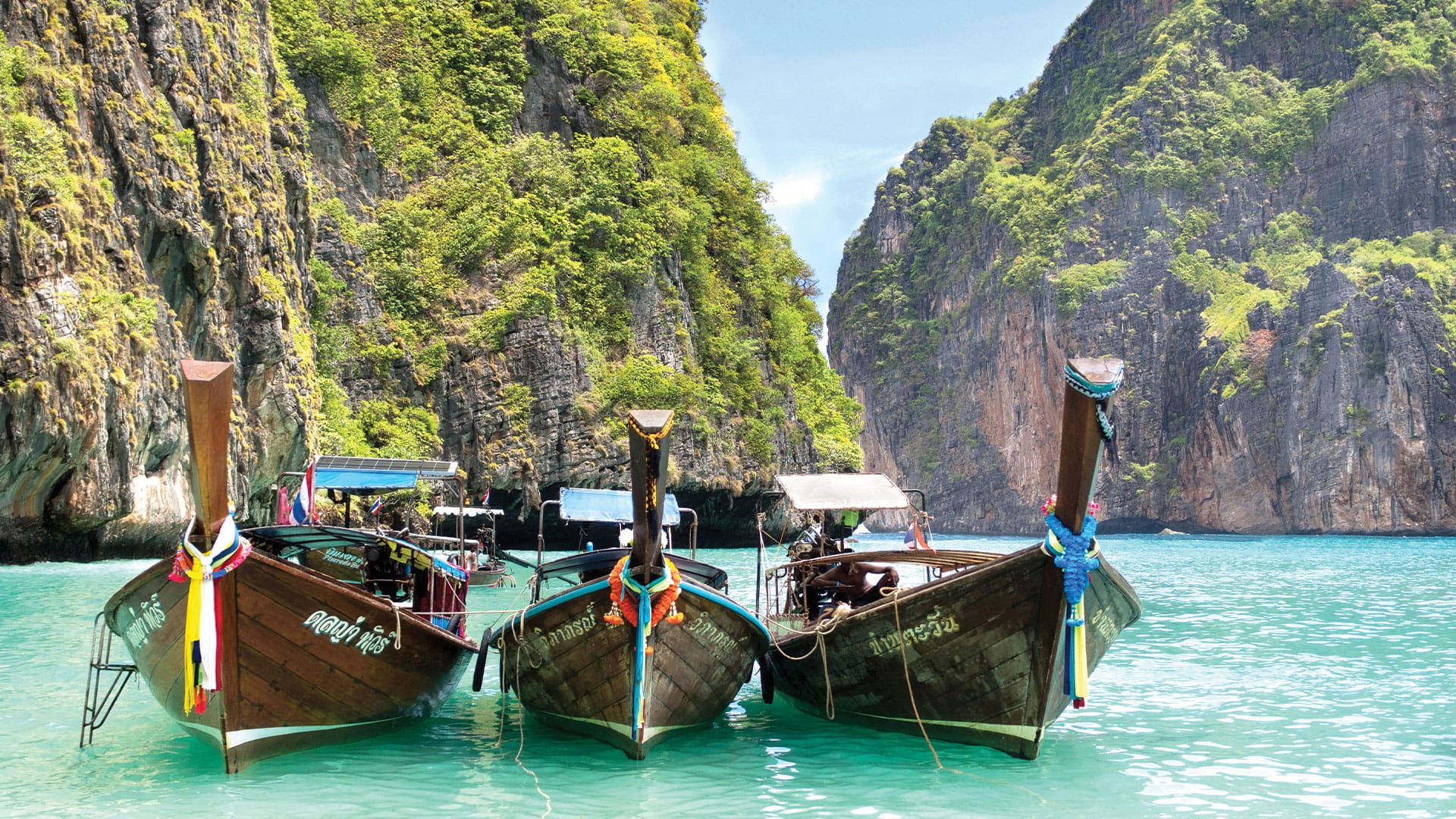 Three travellers at a Thailand island viewpoint