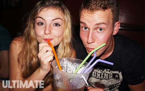 Drinking alcohol from buckets at the full moon party